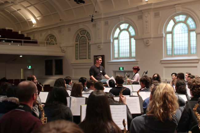 Rehearsal of Mark Phillips's saxophone concerto What If? for 100 saxes.