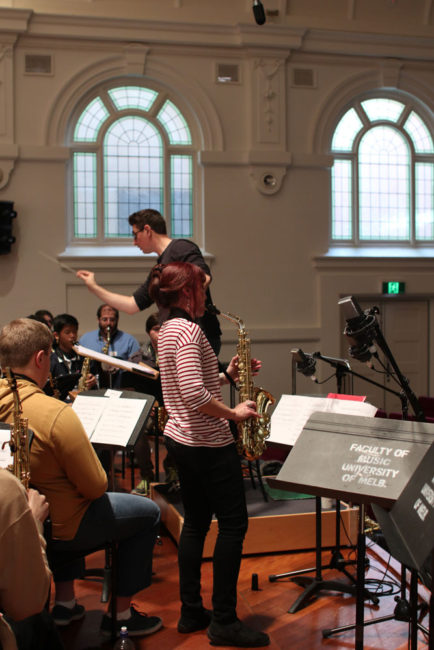 Rehearsal of Mark Phillips's saxophone concerto What If? for 100 saxes.